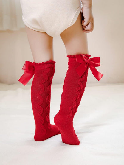 Knee-high socks for infant girls with a non-slip sole. Size: 0-12 months, Color: Cable Style.