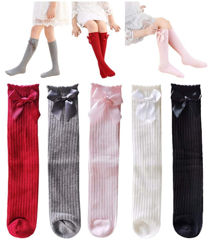 Five pairs of knee-high socks with a bow design for girls, sizes 3–12 toddlers, available in a variety of colors.