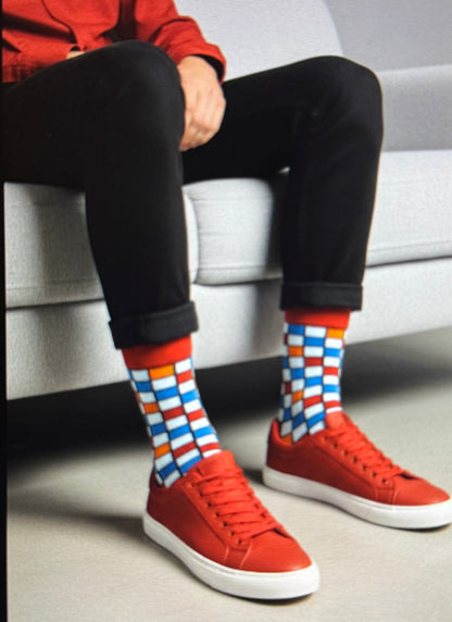 Teenage boys that are knee-high/crew socks, with fun patterns and designs. Sizes:9-13