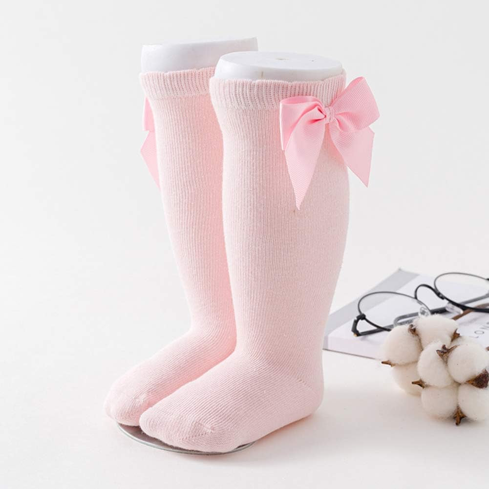 Knee-high socks for infant girls with a non-slip sole. Size: 0-12 months, Color: Solid.