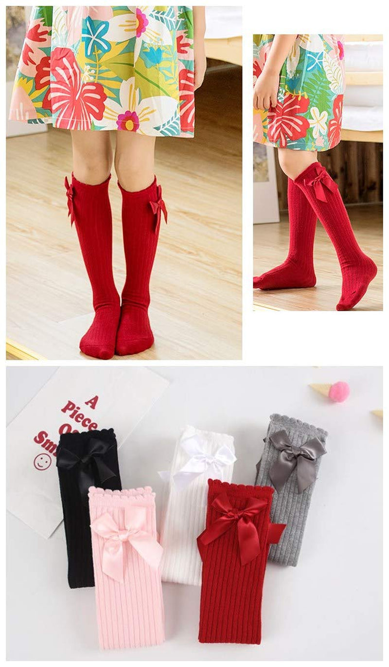 Five pairs of knee-high socks with a bow design for girls, sizes 3–12 toddlers, available in a variety of colors.