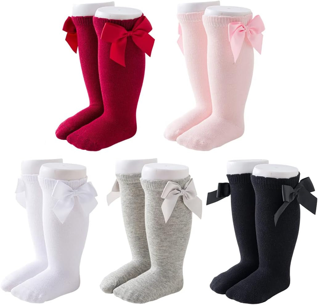 Knee-high socks for infant girls with a non-slip sole. Size: 0-12 months, Color: Solid.