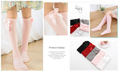 Five pairs of knee-high socks with a bow design for girls, sizes 3–12 toddlers, available in a variety of colors.