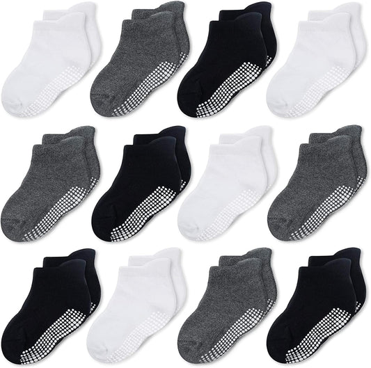 Twelve pairs of boys and girls ankle-high socks with a traction pattern. Size: 3-5T, Color:  Black,White, Dark Grey.  